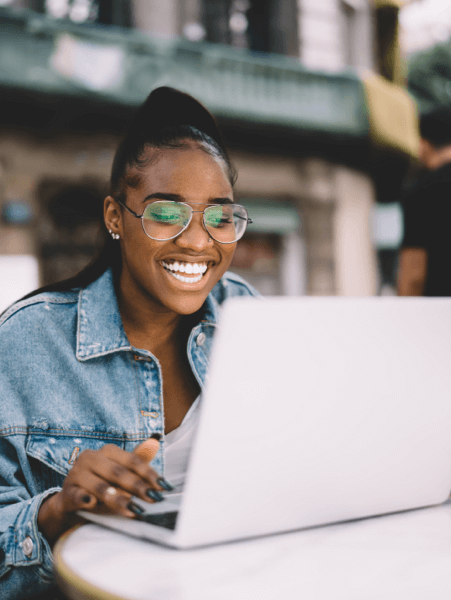 Person using TotalAV&trade; and smiling